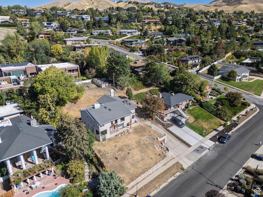 A rare Upper Avenues opportunity with unmatched views and flexible potential. The offering includes two parcels (Tax ID #09-30-479-007, 0.28 acres, and #09-30-478-015, 0.08 acres) totaling 0.36 acres. The existing home, partially demoed but structurally viable, can be renovated and expanded within its current footprint-or removed for a new custom build. Its grandfathered height offers a valuable advantage: by retaining one structural wall and foundation connection during construction, a buyer can preserve the existing height and footprint before new zoning limits and build-start timelines apply. Included: architectural plans, zoning Q&A, asbestos report, prior survey, and demolition bid (~$34,000). With extraordinary downtown and sunset views, minutes from the University and foothill trails, this is one of the most versatile redevelopment sites in the Upper Avenues.Property is sold as-is, where-is.