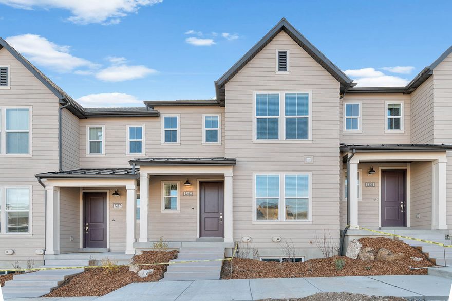Step into this beautiful Keetley Town Home - where thoughtful design meets modern comfort! This home features a stylish kitchen with gray maple cabinets paired with quartz countertops, designer tile backsplash and platinum gas appliances that elevate your culinary experience. Laminate hardwood, vinyl tile, and carpet flooring ensure both beauty and practicality throughout. The home showcases a spacious feel with a half wall at the stairway, large Craftsman base and casing, and two tone paint for a warm, finished look. The owner's bathroom includes cultured marble shower surrounds and is accented with satin and brushed nickel hardware for a clean, elegant touch. A perfect blend of function and style, that comes fully landscaped and maintained by the HOA, the Keetley is move-in ready home waiting just for you, all at a great price!