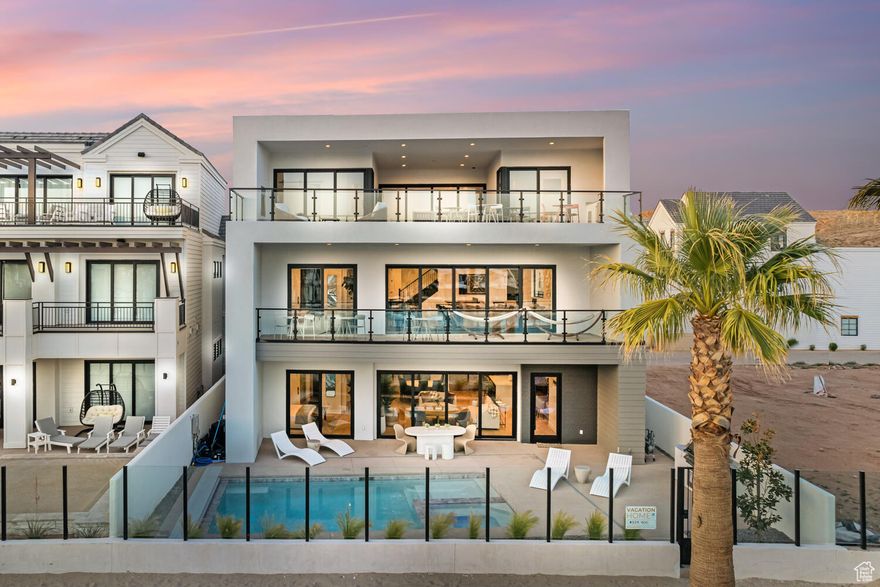 Fractional ownership opportunity - 1/13 share (28+ days annually) Modern Lagoon stands as your ultimate beachfront haven in the heart of the sought-after Desert Color Community in St. George, UT. This fully furnished vacation home boasts 7 bedrooms, 8.5 bathrooms, and 3 expansive gathering areas spread across three levels, offering an unparalleled blend of luxury and coastal living. Step outside and immerse yourself in relaxation with your private pool and hot tub, or take advantage of the Desert Color amenities just steps away. Sitting on the beachfront on the community lagoon, you can enjoy all of the views and excitement that this one-of-a-kind oasis offers. From pickleball courts to a  community pool and the breathtaking 2.5 acre lagoon, endless entertainment options await right at your doorstep. Nearby sand volleyball courts add to the outdoor fun and games, ensuring there is never a dull moment.  Modern Lagoon is fully equipped with everything you need for an unforgettable vacation. Whether you're paddling on the lagoon with provided paddle boards and kayaks or enjoying beach volleyball and spike ball in the sand, there's something for everyone to enjoy. Indoors, an arcade, ping pong table, air hockey, shuffleboard, and home theater await, guaranteeing entertainment for guests of all ages.  With accommodations for over 28 guests and a spacious 6,338 square feet of living space, Modern Lagoon is the perfect destination for gatherings with family and friends. Simply pack your suitcase and head to your favorite place with your favorite people - paradise awaits in Desert Color. Don't miss out on the opportunity to make this stunning beachfront property your own and experience coastal living at its finest with Fraxioned.