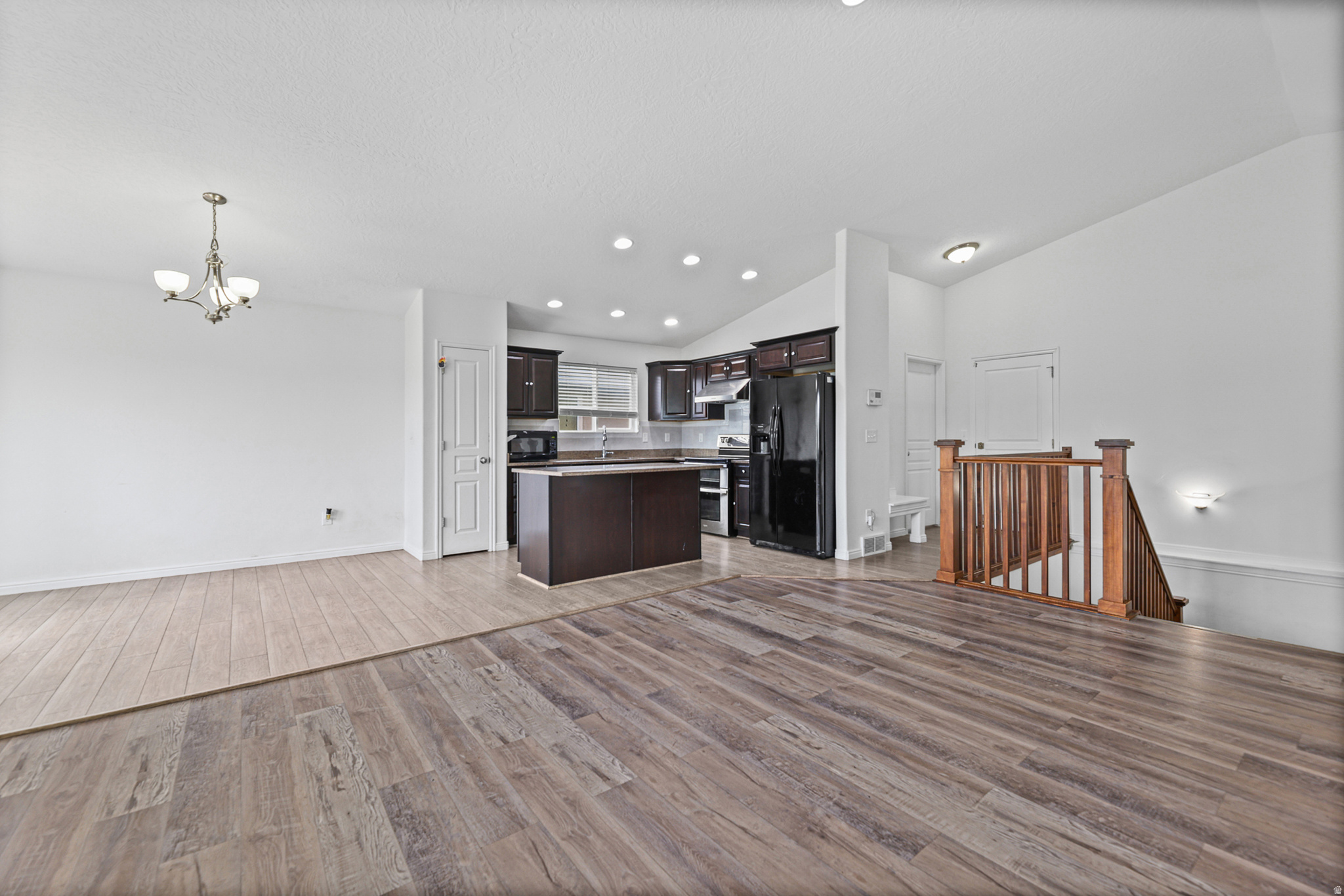 Spacious dining area with an open-concept design that flows naturally into the kitchen and living spaces, creating a comfortable setting for everyday meals or entertaining.