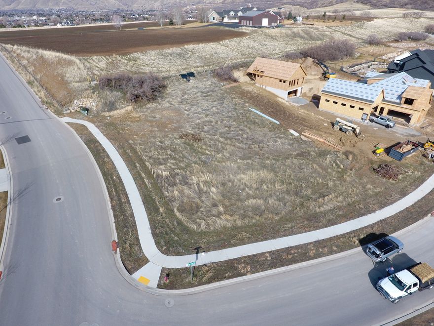 Located in south Mapleton's sought-after Twin Hollow subdivision, this premium lot offers stunning views of Maple Mountain, quiet surroundings, and private walking trails. Lots range from 0.75 to 1 acre, providing space and privacy among high-end custom homes. Seller is a licensed builder and can provide a custom build bid. Listed price is for the lot only; seller offers pricing consideration if selected as builder.