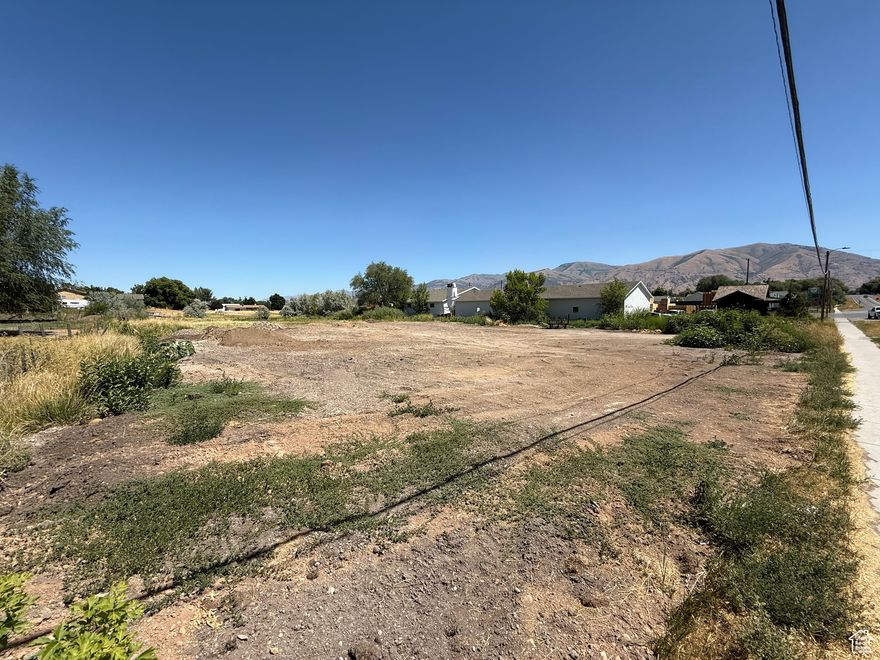 Reduced Price only available until 12/31/2025!  Discover the potential of this versatile 1.07-acre lot located at 365 W Main Street in the heart of Hyrum, Utah. Zoned for both commercial and residential use, this rare offering provides a wide range of development possibilities-whether you're looking to build your dream home, establish a thriving business, or invest in a mixed-use property.  Situated along a well-traveled stretch of Main Street, the property offers excellent visibility and accessibility, making it ideal for retail, office space, or a home-based business. With over an acre of land, there's plenty of space for parking, storage, or future expansion.  This is your chance to secure a prime piece of land in a growing community with flexible zoning and unlimited potential. Whether you're an investor, entrepreneur, or future homeowner-opportunity awaits.
