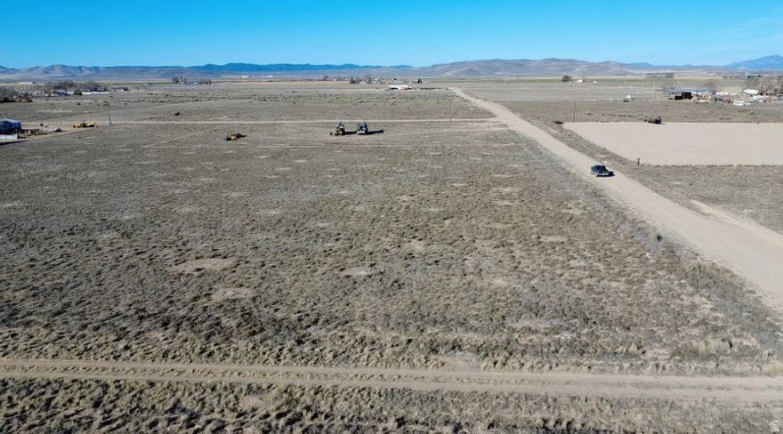 0.50 acre, flat and ready to build, lot in Beryl Junction with a well to be installed prior to closing and a well share agreement with the parcel to the South. Includes 0.5 Acre Foot of Water Right #71-6066 (Priority Date 12/27/1956). Dixie Power is located just 200 feet away on 300 East. Excellent Highway 18 access with easy year-round access. Ideal for a primary residence, second home, cabin, or weekend retreat. Bring your RVs, trailers, and toys. Great opportunity to build now or buy and hold as water-backed land continues to grow in value. Located 15 minutes to Enterprise for groceries, gas, schools, dining, and medical, and about 50 minutes to St. George or Cedar City. Close to reservoirs for boating and fishing. Explore all of the nearby mountain trails with your off road vehicles.