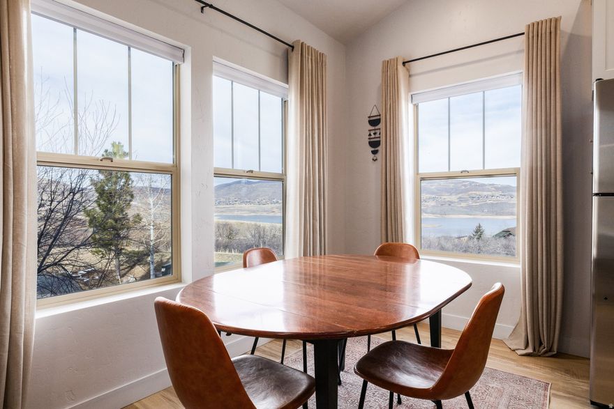 Beautifully renovated and turnkey, this 2-bedroom, 2-bath condo captures sweeping views of the Jordanelle Reservoir from nearly every room and sits just five minutes from Deer Valley's East Village. Leave the car behind as a complimentary shuttle service picks you up right at your door and delivers you directly to the Village. After a day on the slopes, unwind by the gas fireplace, grill with a view, or gather for game night at the dining table. One of only two Fox Bay units with vaulted ceilings, the home lives larger than expected and is filled with natural light. Recent upgrades include new flooring, kitchen cabinetry, kitchen and bath countertops, furnishings, light fixtures, and fresh paint throughout. In warmer months, relax on the spacious deck while taking in reservoir and mountain views. Additional features include in-unit washer and dryer, two garage parking spaces, and access to community amenities including a pool, hot tub, pickleball courts, and fitness center. Ideally located just 10 minutes from Park City's Historic Main Street and the Heber Valley, with hiking and biking trails right outside your door. Approved for nightly rentals with a 7-night minimum, this unit has a solid rental track record.