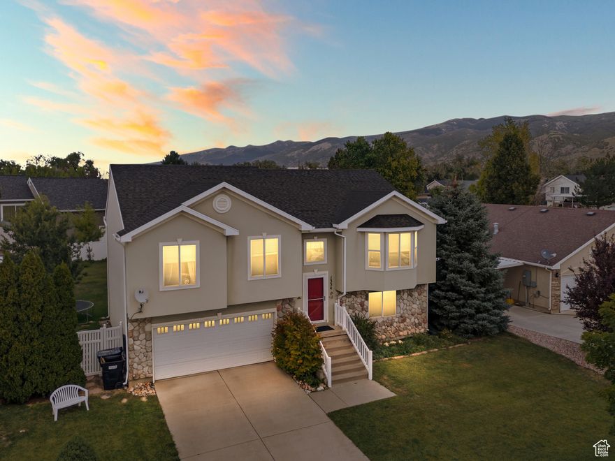 Seller is willing to contribute towards buyer's closing costs. Bring us an offer!  Well kept and turn key! This Woods Cross home is Nestled in Argyle Acres. The home boasts of curb appeal and sits on a large and well manicured lot. Walking through the front door and up the stairs, the main level welcomes you with ample natural light, vaulted ceilings, and a thoughtful layout. The large living area features large box bay window and flows beautifully to the kitchen. With appliances included, the kitchen features a breakfast bar and ample storage. Step through the sliding glass doors and onto the elevated deck that overlooks the private backyard, where you can sit to enjoy your morning coffee and the views of the Wasatch Mountains. The main level also features 3 bedrooms and 2 full baths. The generously sized primary suite features a walk in closet, and an ensuite bath with a dual sink vanity and separate tub and shower. The lower level features a second large living area, bedroom and full bathroom. This space invites natural light and sliding glass doors leading out to the fully fenced backyard retreat. The backyard offers a large covered patio, established landscaping including fruit trees, and garden beds. Two outdoor sheds allow storage for your garden tools and yard equipment. This outdoor space is perfect to entertain guests, host BBQs, or make smores and memories around the fire pit. The two car garage is extra deep to accommodate extra storage space. Conveniently located just minutes to I-15, this home is perfectly balanced between location, thoughtful layout, and outdoor space. Schedule your private showing today to see first hand all this turn key home has to offer! Square footage figures are provided as a courtesy estimate only and were obtained from county records. Buyer is advised to obtain an independent measurement. Buyer and Buyer Agent is to verify all.