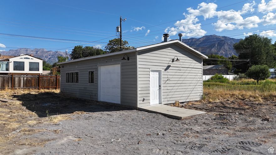 Private flag lot off a quiet CUL-DE-SAC. Property features a 800 SQFT workshop WITH POWER, plumbed PNEUMATIC AIR THROUGHOUT, very well INSULATED, garage heater, and overhead door. Perfect building lot or investment property. Lots of possibilities with the existing shop. Perfectly situated near BYU, UVU, and Utah Valley Regional Medical Center, this prime location offers convenience and accessibility. Don't miss out on this hard-to-find gem! *** OWNER AGENT *** Power connected, no other utilities currently connected.