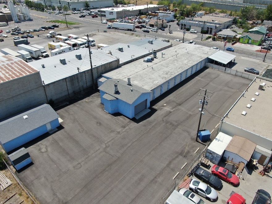 Warehouse building with fenced yard. Great location off of 3300 S in South Salt Lake. The city does NOT allow any Automotive uses.  Heavy power, 3 phase 800 amps Fire suppressed  Large signage  Extra storage in rear.  Short term lease available