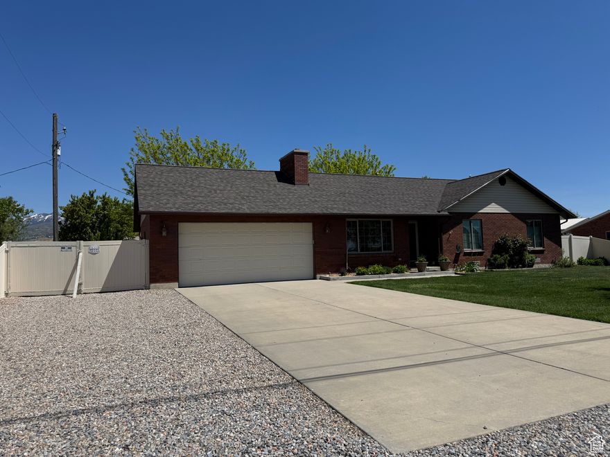 Discover the perfect blend of rural charm and urban convenience with this exceptional Ranch style home on 2.07-acres, just minutes from downtown Salt Lake City.  This Ranch Style home boasts ample acreage, providing plenty of room for horses, gardening, or other outdoor pursuits. Included with the sale are 2.0 water shares, ensuring a reliable water supply for irrigation and livestock needs.  Enjoy the best of both worlds-peaceful rural living with the vibrant amenities of downtown SLC.  Schedule a showing today and envision the possibilities that await you on this remarkable property.