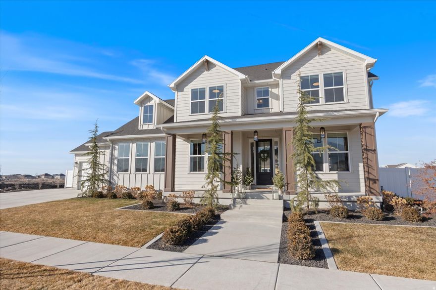 Stunning luxury semi custom Cadence Home located in Vineyard's Holdaway Fields community. This nearly 5,000 sq. ft. property offers 6 bedrooms and 4.5 bathrooms, thoughtfully designed with the primary suite conveniently located on the main level. Enjoy the open-concept floor plan featuring vaulted ceilings in the great room, seamlessly flowing into a gourmet kitchen complete with gas range, double ovens, oversized walk-in pantry, and ample space for entertaining. Custom paint, accent walls, and window treatments elevate the home throughout, while laundry rooms on every level add exceptional convenience. The oversized 3 car garage provides generous room for storage, workshop space, toys, and additional side parking allows space for extra vehicles or an RV. Situated on a large corner lot, this professionally landscaped yard is an entertainer's dream, featuring a swim spa, in-ground trampoline, large deck, and plenty of outdoor living space. Enjoy breathtaking mountain and lake views in this outstanding community that offers sidwalks, parks, and scenic trails. This exceptional property blends luxury, functionality, and lifestyle in one the County's most sought after neighborhoods.