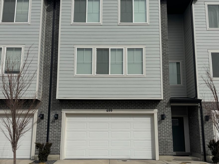 This stunning 3 bedroom, 3 bathroom townhome offers a perfect blend of modern elegance and generous space, ideal for comfortable living and entertaining. The home boasts and abundance of natural light thanks to its huge windows, creating bright, airy interiors throughout.  The new fireplace serves as a cozy focal point in the spacious living area that compliments the open layout. Impressive 4 car garage rare for a townhome offers tons of parking, storage, workshop potential or other hobbies. Basement access through the garage that has endless options. Please allow 2 hour notice for showings. Buyer and buyers agent to verify all information. Sq footage is provided as an estimate only.