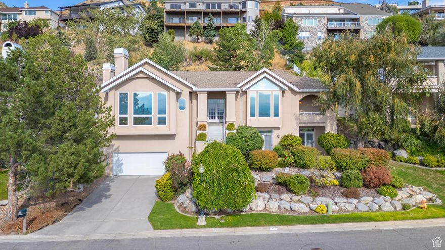 **HUGE PRICE REDUCTION!** Welcome to 2471 E Scenic Drive - an elegant home nestled in the highly sought after East Bench of Salt Lake City.  This home boasts an open, multi level floor plan with generous room sizes, an abundance of natural light and unbeatable unobstructed views of the Salt Lake Valley.  Located minutes from freeway access, world-class dining and shopping, the University of Utah and Primary Childrens Medical Center, this home is perfect for discerning buyers seeking both comfort and convenience.    Square footage figures are provided as a courtesy estimate only and were obtained from a recent appraisal.  Buyer is advised to obtain an independent measurement.