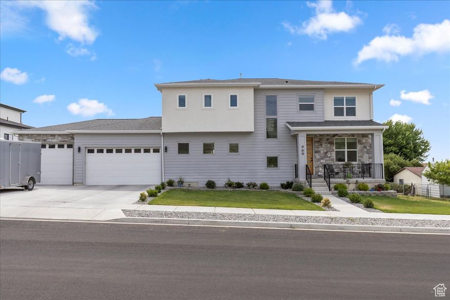 Price adjustment! This exceptional home, now offering an enticing opportunity to own on the east bench of Tooele along hole #16 of the Oquirrh Hills Golf Course.  This stunning modern home offers panoramic 360-degree views of both the golf course and surrounding mountains. with unmatched access to nature and nearby trails, it's the ideal blend of modern comfort, style, and functionality - perfect for both families and entertaining. The main floor features an open-concept layout with 10-foot ceilings, laminate hardwood flooring, oversized windows that flood the space with natural light, and breathtaking views in every direction. The gourmet kitchen boasts quartz countertops, premium appliances, and generous workspace. The luxurious master suite includes a spa-inspired bathroom with double sinks, a standalone dual tub, a large walk-in shower, and a spacious walk-in closet. Additional highlights include dual furnace system, an extra-wide and deep three car garage with epoxy flooring and a 240V outlet for electric vehicle charging. This home is truly one-of-a-kind in the area - an absolute must see! Square footage figures are provided as a courtesy estimate only.  Buyer is advised to obtain independent measurements.