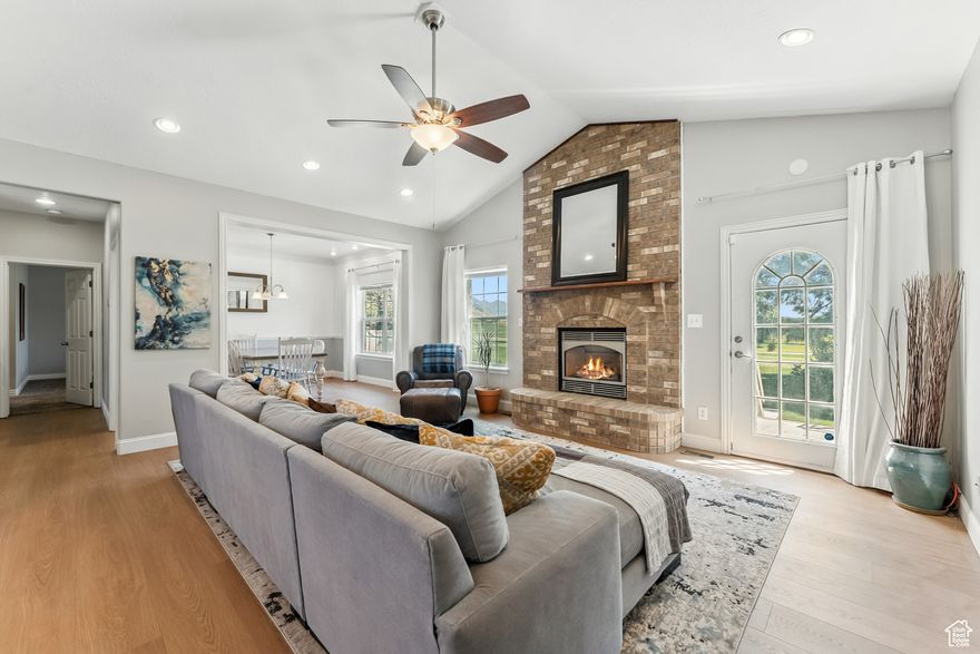 Welcome to this beautiful home with no backyard neighbors!  This home backs up to the 6th hole tee off of the Alpine Country Club.  You'll love the huge south facing windows, which let in abundant light and amazing views.  The recently updated kitchen is light and bright featuring stainless appliances, a gas range, and granite counters.  Enjoy lounging indoors with new flooring or get your vitamin D on the patio outside and enjoy the new landscaping and fully fenced, quiet back yard.