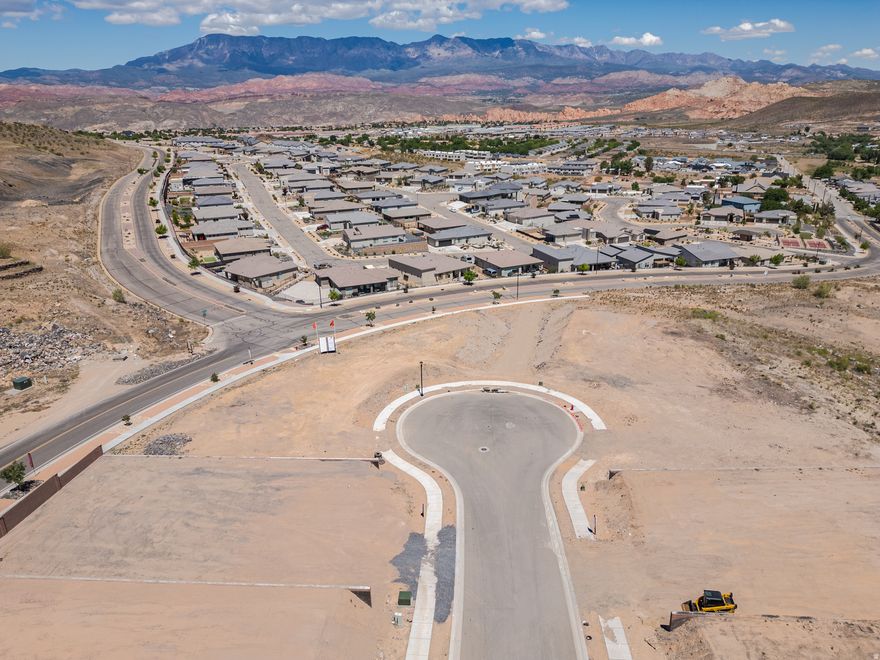 0.20 acres at the end of a cul-de-sac to build the home of your dreams! This lot features views of pine mountain, the coral cliffs and the peaks of Zion National Park.