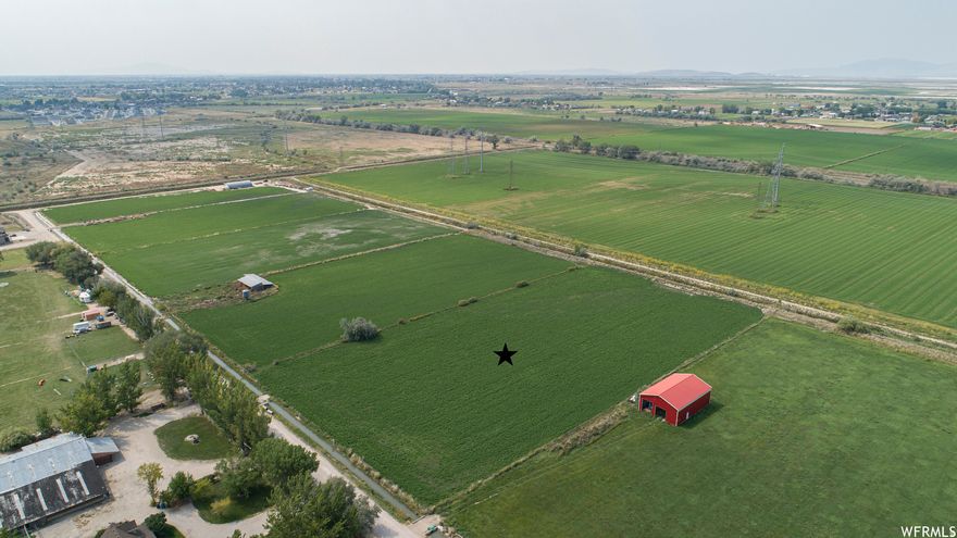 If you've been dreaming of building your perfect home with room to spread out and enjoy country living, this property is a must-see! With plenty of space for a small farm, animals, gardens, or a shop, you'll love the peaceful surroundings and scenic views while still being conveniently close to local amenities. Even better, the parcel offers the potential to be divided into approximately four 1.25-acre lots, creating endless possibilities for future development or investment. Rare opportunities like this don't come around often!