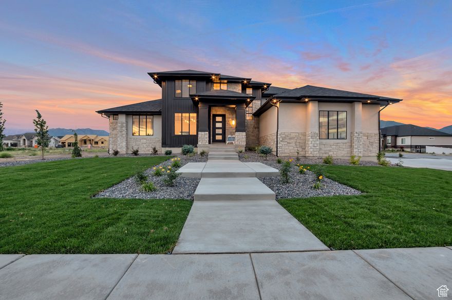 LOT#318. This stunning Symphony Homes MODEL home is for sale! This Forte XL plan is a dream! The BEST of everything between upgrades and designer touches! Huge kitchen has two kitchen islands, a large butler's pantry with hidden door, gas cooktop range, double wall ovens, fridge and freezer, and 2nd sink! Enormous laundry room with tons of cabinets and a sink. Stunning primary suite with modern bathroom that feels like a spa, and walk-in closet that's its own room with a window and custom built-ins! Upper level catwalk overlooks entry and great room. All bedrooms are oversized. The finished basement boasts an open theater, gym, and wet bar! Large covered patio is the best place to enjoy a shady evening and mountain views. Nicely landscaped corner lot with pull through driveway, concrete pad for additional parking space, and also features an attractive gas firepit. One of Kaysville's premier communities with a neighborhood swimming pool!