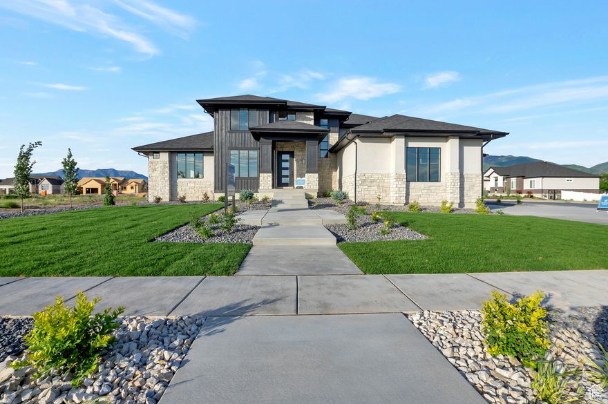 LOT#318. This stunning Symphony Homes MODEL home is for sale! This Forte XL plan is a dream! The BEST of everything between upgrades and designer touches! Huge kitchen has two kitchen islands, a large butler's pantry with hidden door, gas cooktop range, double wall ovens, fridge and freezer, and 2nd sink! Enormous laundry room with tons of cabinets and a sink. Stunning primary suite with modern bathroom that feels like a spa, and walk-in closet that's its own room with a window and custom built-ins! Upper level catwalk overlooks entry and great room. All bedrooms are oversized. The finished basement boasts an open theater, gym, and wet bar! Large covered patio is the best place to enjoy a shady evening and mountain views. Nicely landscaped corner lot with pull through driveway, concrete pad for additional parking space, and also features an attractive gas firepit. One of Kaysville's premier communities with a neighborhood swimming pool!