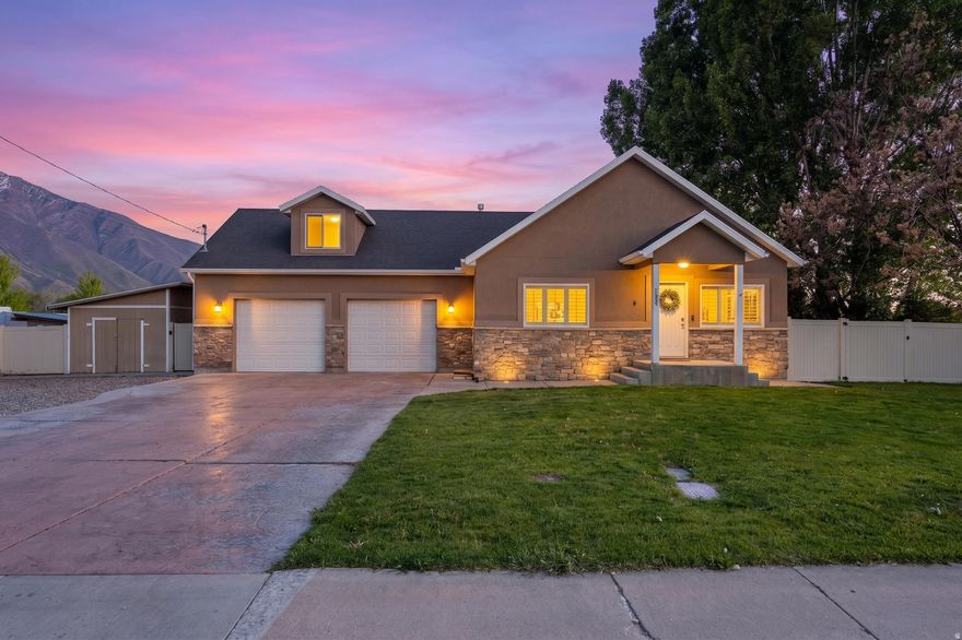 Brand-new paint and carpet throughout give this beautiful Mapleton home a fresh, move-in-ready feel. Situated on a spacious .34-acre lot, the property features a huge concrete pad with plenty of room for extra parking, RVs, trailers, toys, and a water softener. High ceilings throughout the home create an open, airy feel with abundant natural light. The fully finished basement offers a large family room with a built-in fireplace, a brand-new full bathroom, and a separate closed-off room perfect for a home office, gym, playroom, or flex space. Upstairs, you'll find spacious bedrooms throughout, including two bedrooms on the mail level, and a generous master bedroom with his-and-hers walk-in closets.  Conveniently located just minutes from Mapleton school and parks. This home combines the peaceful charm of Mapleton living with easy access to nearby Springville and Spanish Fork amenities and restaurants. Opportunities to own a great home with this much space in Mapleton don't come available often!  Square footage figures are provided as a courtesy estimate only and were obtained from county records.  Buyer is advised to obtain an independent measurement.