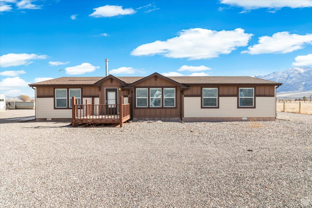 This 3-bedroom, 2-bathroom manufactured home, built in 2018 by Champion Homes, offers 1,897 sqft of modern living space on 3.85 acres of beautiful land. Featuring the Rocky Mountain package, the home includes superior insulation and a higher snow load roof for year-round comfort. The property also boasts a 40x40 heated shop with a dual mini-split and wood stove, a 30x30 carport, and a 5-horsepower irrigation pump with two wheel lines, ideal for maintaining the 1.75-acre hay field. There is also a 40x40 animal pen. With 3 water shares of Richfield Canal and an oversized water meter, the land is well-equipped for agricultural use. A 34-foot 5th wheel trailer with a wood stove, set up for permanent living, will remain on the property unless not wanted. At $525,000, this property combines a comfortable home with ample space for animals, hobbies, and projects, offering both convenience and rural charm!  Square footage figures are provided as a courtesy estimate only and were obtained from  a recent appraisal.  Buyer is advised to obtain an independent measurement.