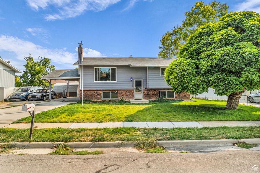 Welcome to this charming split-entry home at 1937 W 1620 N in Layton, UT! Built in 1977, this well-maintained single-family residence offers approximately 2,000 square feet of living space, featuring 4 spacious bedrooms and 2 full bathrooms-perfect for families, first-time buyers, or investors.Step inside to discover a bright and inviting layout with two large family rooms, ideal for entertaining or relaxing. The open kitchen boasts ample cabinets, generous counter space, and includes essential appliances like a dishwasher, garbage disposal, microwave, range/oven, and refrigerator. Cozy up by the fireplace on cooler evenings, and enjoy the comfort of carpet and laminate flooring throughout. The finished basement provides extra flexibility with its separate entrance, making it great for a home office, guest suite, or additional living area.Outside, unwind on the cute covered deck overlooking a good-sized backyard complete with a storage shed. The 0.18-acre lot includes RV parking on the side and a convenient carport for your vehicles. With forced air gas heating and central cooling, you'll stay comfortable year-round.Nestled in a desirable Layton neighborhood, this home is close to schools like Vae View Elementary, Central Davis Middle, and Layton High, as well as shopping, parks, and easy freeway access for commuting to nearby Hill Air Force Base or Salt Lake City. Don't miss this super cute gem-schedule your showing today!