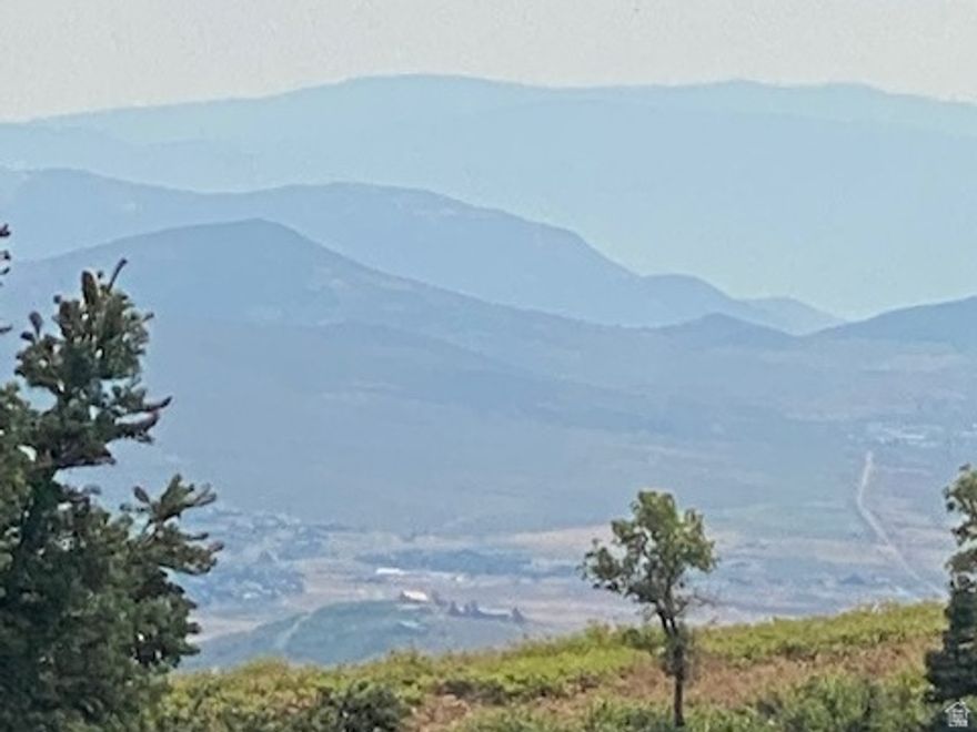 This .61-acre parcel is just 325 yards from the winter plow route, making it an ideal spot for your dream home. Imagine enjoying the sunrise from your deck, with stunning views of the High Uintas and the abundant wildlife the ranch offers. This mountain-living experience truly feels like a vacation on your own property. The parcel is situated in the heart of the Pine Meadow Ranch HOA, and you're only 15 minutes from restaurants and shopping, only 25 minutes to world-class skiing, and 40 minutes to Salt Lake International Airport. Your dream home can sit perfectly situated between the majestic pines. If you're fortunate enough to be able to work from home, you can sit on the deck in the morning sun while attending those Zoom meetings to the astonishment of those on the other side of your laptop screen.