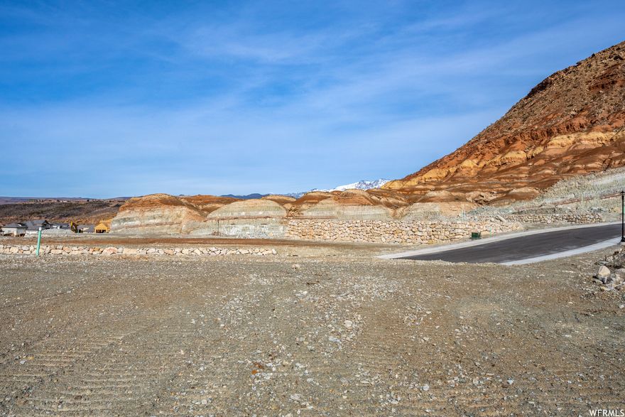 THIS LOT IS A MUST SEE! Large 0.5 acre building view lot with incredible mountain views and city lights. Build your dream home on this lot in the last phase of the prestigious Indian Knolls development. Only 9 lots left. Bring your own builder on these graded, pad ready to build lots.  You'll fall in love with this neighborhood that sits above Washington Fields, yet minutes to town, schools, parks and shopping. A high-end custom home subdivision with low utility costs on Dixie Power. All engineering finished with great soils.