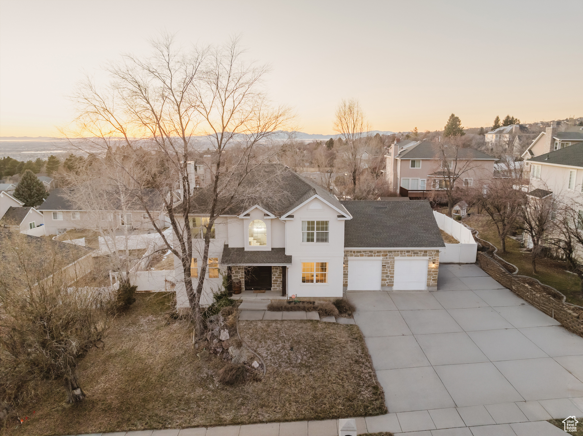 Welcome home to this beautifully remodeled retreat, just minutes from the North Ogden Divide-offering quick access to outdoor adventures and some of the most breathtaking sunset and mountain views in the area.  Inside, you'll find brand-new carpet and a stunning custom staircase, elevating the bright and open layout. The spacious living areas seamlessly connect to the updated kitchen, creating the perfect space for entertaining or relaxing in style.  Looking for flexibility? This home features two laundry hookups and a separate entrance, making it ideal for a mother-in-law suite or potential rental opportunity. Plus, with RV parking, you'll have plenty of space for all your outdoor gear and vehicles.  With modern updates, a smart layout, and a prime location near trails and recreation, this home is the perfect blend of comfort and convenience.  Schedule your private tour today!