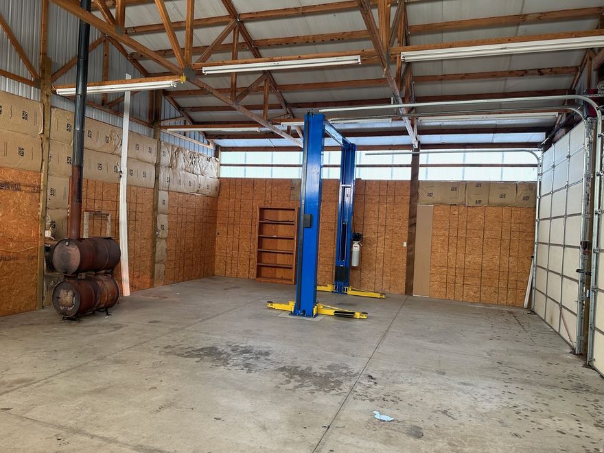 Featuring Mechanic's dream, 4 car shop which just so happens to have a charming 3 bed 2 bath fully remodel(2020) home with attached garage directly in front of shop. Updated home has granite countertops, tile+hardwood floors, solid wood cabinets, patriots series Low E windows, 18" additional attic insulation, foam HVAC ducting insulation treatment, new water heater(2025), 100% new plex plumbing to the street, metal roof!. Shop has two 12' garage doors w/ 30'X40' 6" concrete slab. Multiple 240v & 120v outlets mounted to several walls. 2020 Atlas 12ft 10,000lbs 2 post vehicle lift. Double barrel wood burning stove, city water in shop, air line run to house garage.  Property also has a water well. If you're a person who works on your own vehicles and needs an acre of land to boot, this home  is for you!!!