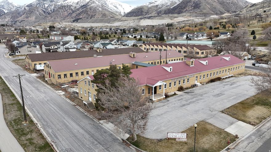 Rare historic warehouse in Brigham City. Features exposed brick, wood beams, and original oak floors. Ideal for creative office, flex, or distribution. Former WWII hospital near the USU Brigham City campus. Unique character with versatile potential.