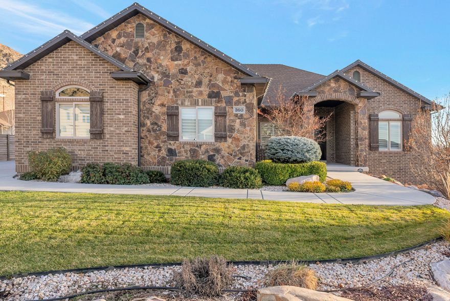 This exceptional home showcases sweeping views of both the valley and surrounding mountains-an inspiring backdrop in every season. An expansive deck extends the living space outdoors, perfect for entertaining or unwinding on peaceful evenings. Inside, generous gathering areas create a warm, inviting environment for everyday living and hosting guests alike. Immaculate and meticulously maintained, the home feels like new, featuring upgraded crown molding, three-tone paint, and enhanced cabinetry throughout. The finished garage offers epoxy flooring and a rare floating garage floor system, providing substantial additional storage space in the basement. The basement lives like a second home, complete with a spacious living area, cozy fireplace, theatre room, dedicated laundry, and rough-ins for a kitchen. If that wasn't enough, the home also features abundant parking, including an RV pad, and a professionally landscaped yard.