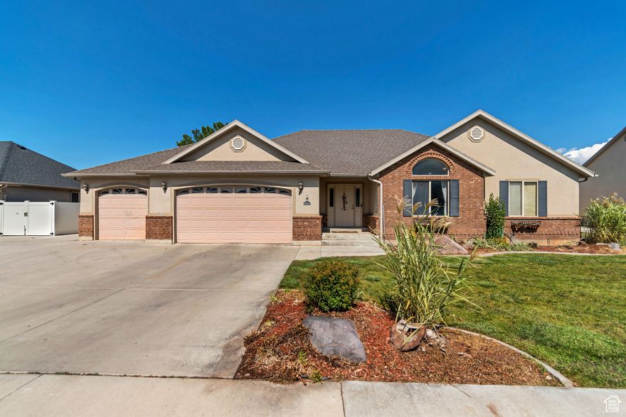 *Agent is Related to Seller* Welcome to this versatile home in the quiet Aspen Meadows subdivision of Spanish Fork! Offering 4 bedrooms and 3 bathrooms with a basement. The front living room has been converted into a hair salon with water hookups, and the basement features a cold storage room, a full kitchen, laundry, and tons of storage - easily adaptable into a rental apartment with a simple door adjustment. The primary en-suite is equipped with a walk-in shower, separate bathtub and dual sinks. The kitchen offers a newer dishwawsher while the house has a new HVAC. Outdoor living is a dream with a primary bedroom deck, paved patio, 8x10 pergola, RV parking with gated access, a 10x20 shed plus covered storage, and fully landscaped grounds with irrigation water available in the summer. Just minutes from schools, all abilities park with splash pads and waterfalls, shopping, dining, Costco, the fairgrounds, and 10 min drive to downtown with no HOA fees.