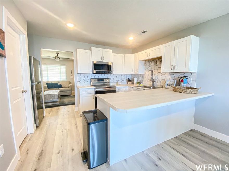 PRICED $25k BELOW RECENTLY SOLD UNITS IN COMPLEX. Already Booked with Nightly Rentals For 2026 - New Buyer to Enjoy Substantial Rental Income. NEWLY REMODELED THROUGHOUT. If you're going to have a CONDO in Bear Lake, shouldn't you have one with SPECTACULAR VIEWS, GORGEOUS FINISHES AND FURNISHINGS, and enjoy the HARBOR VILLAGE AMENITIES like SWIMMING & TENNIS? You won't find a FINER one at This Price. Short term rentals are allowed. A unique opportunity to own this FULLY FURNISHED & TURN-KEY condo that can be rented out when you're not using it. The building has a newer roof & craftsman style LP siding. Appliances & Furnace/AC are all new. Minutes to the Marina, Grocery Stores, Restaurants, Bike Rental Shops, Bike Paths & more! Only 15 minutes to Beaver Mountain ski resort. HOA includes Access to Pool, Spa, Tennis Courts, Bike Rental Station, & covers Water & Cable TV. Everything about this condo is FIRST CLASS.