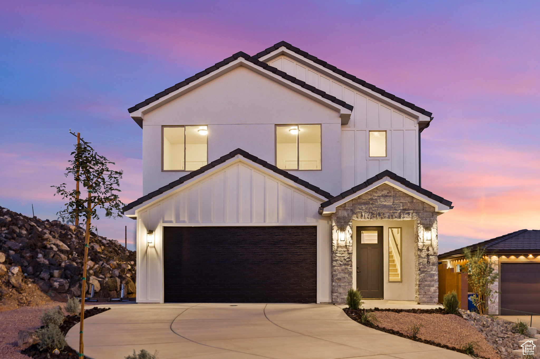 This home boasts a spacious floor plan, which includes a large open-concept living area with abundant natural light, tall ceilings, and direct access to a cozy balcony with impressive views of the surrounding landscape. The kitchen is equipped with sleek, white cabinetry, state-of-the-art stainless steel appliances, and a large island perfect for family gatherings and entertaining guests. Offering multiple bedrooms and bathrooms, each room combines functionality with chic, minimalist design, ensuring spaces that are as comfortable as they are beautiful. Outside, the property features a minimalistic landscape perfect for those valuing simplicity and low maintenance, while the proximity to local amenities ensures ultimate convenience.