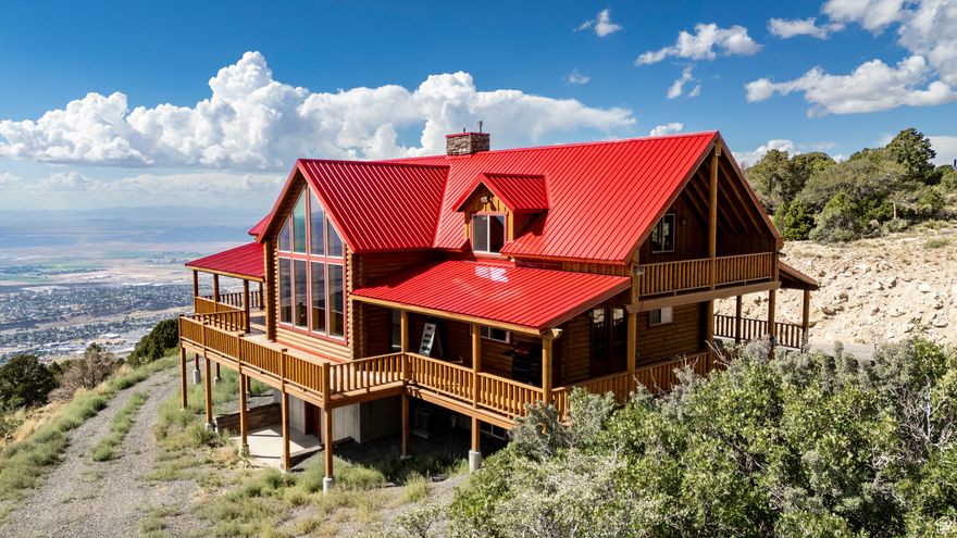 Escape to the serene beauty of Cedar Mountain with this stunning 3,400 square-foot luxury cabin, perfectly perched above Cedar City, Utah. This spacious mountain retreat offers breathtaking panoramic views of the city below and the surrounding natural landscape, making it an ideal getaway for those seeking tranquility and adventure.  - 3 Bedrooms, 4.5 Bathrooms: Spacious accommodations perfect for family gatherings or group getaways. - Gourmet Kitchen: Fully equipped with high-end stainless steel appliances, granite countertops, and a large island, perfect for entertaining. - Grand Living Area: Vaulted ceilings, a stone fireplace, and large windows provide a cozy atmosphere while showcasing the incredible views.