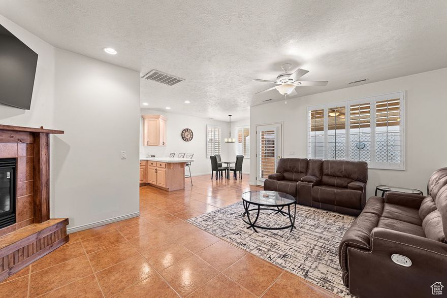 VIEW of Pine Valley Mountain and Red Rocks is included in this pristine 3-bedroom, 2-bath home in Ridgepointe (55+ community) offers a perfect blend of comfort and style. The spacious layout features a move-in ready interior with neutral colors, a cozy corner fireplace, plantation shutters and recently added $20,000 solar panels. The oversized garage provides abundant storage, while the secluded backyard ensures a private escape. Low HOA dues that include clubhouse, pool, exercise room, and more. This home is ready to welcome you to relaxed living. Gently used as a second home.