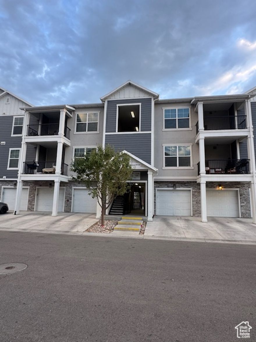 This exceptional condo boasts an attractive floor plan and is ideally situated in a prime location in Vineyard. It has been freshly painted with newly installed carpet.  This 3-bedroom 2-bath condo has vaulted ceilings in the family room and primary bedroom. The great room has large windows to let in natural light and bring the views inside. Walk out to the balcony & enjoy the fresh air, mountain views & the beautiful surroundings. The well-designed kitchen includes quartz countertops, stainless steel appliances & plenty of cabinet space. Refrigerator included. The dining area is very spacious. Down the hallway you have the convenience of a laundry room with lots of storage. Washer and Dryer included.. The large primary suite is welcoming with an en-suite bathroom and a large walk-in closet. Waters Edge is an energetic master-planned community in Vineyard, Utah. Enjoy access to top-tier community amenities to enhance an active lifestyle. Conveniently located just west of Orem in the town of Vineyard, Waters Edge encompasses more than 400 acres between I-15 and the eastern scenic shoreline of Utah Lake. It's an active lifestyle community that includes nearly 7 miles of walking & biking trails that weave through the community. Also includes heated pools open year-round, multiple clubhouses & fitness centers. Includes many other amenities such as playgrounds, parks, a splash pad, & sports courts with tennis & pickleball courts. There are recreation programs for both kids & adults, making it easy to stay active & connected. You're close to dining, shopping, and entertainment like a megaplex theater & top golf, while still enjoying everyday living. You're also minutes from the marina and local universities. Just 8 minutes to UVU, 3 minutes to the Vineyard FrontRunner Station, 5 minutes to I-15 freeway & a quick walk to the community amenities. It's right next to the new Utah City which will include commercial spaces, shops, restaurants, parks, public areas, some residential and a new research campus for the Huntsman Cancer Institute. Come see why so many people are choosing Vineyard. Whether you are heading to college, heading to work or need a second home, this property fits all walks of life. A perfect blend of modern style and vibrant community making this a fantastic option for both homeowners and investors. Come see why so many people are choosing Vineyard and schedule your showing today!