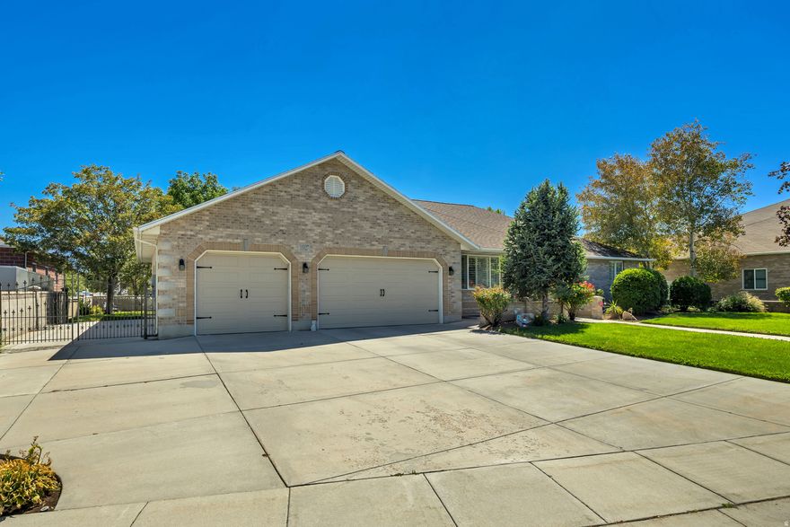 Large all brick rambler with 3 car garage in South Jordan. New fridge, stove & microwave 1 week ago 3/10/26. New roof 5 years ago, New water Heater & New furnace 4 years ago. Large RV parking, permanent holiday lighting, & secondary water. Amazing large Ranch style home has oversized rooms & closets making it open and inviting, large gathering areas, huge deck for entertaining, euro glass master walk in shower and unwind and relax under mature trees & yard for shade and privacy. home has a lot of great features too many to list.   Square footage figures are provided as a courtesy estimate only and were obtained from MLS.  Buyer is advised to obtain an independent measurement.