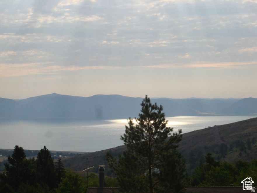 Breathtaking lot in Bridgerland Subdivision. This lot has mature trees, and amazing views of Bear Lake. Nice Gradual Slope to make for a prime building lot. Over a half a acre to enjoy the mountains and landscape. Ride your ATV's from here to the many miles of trails near by. Come drive by today!