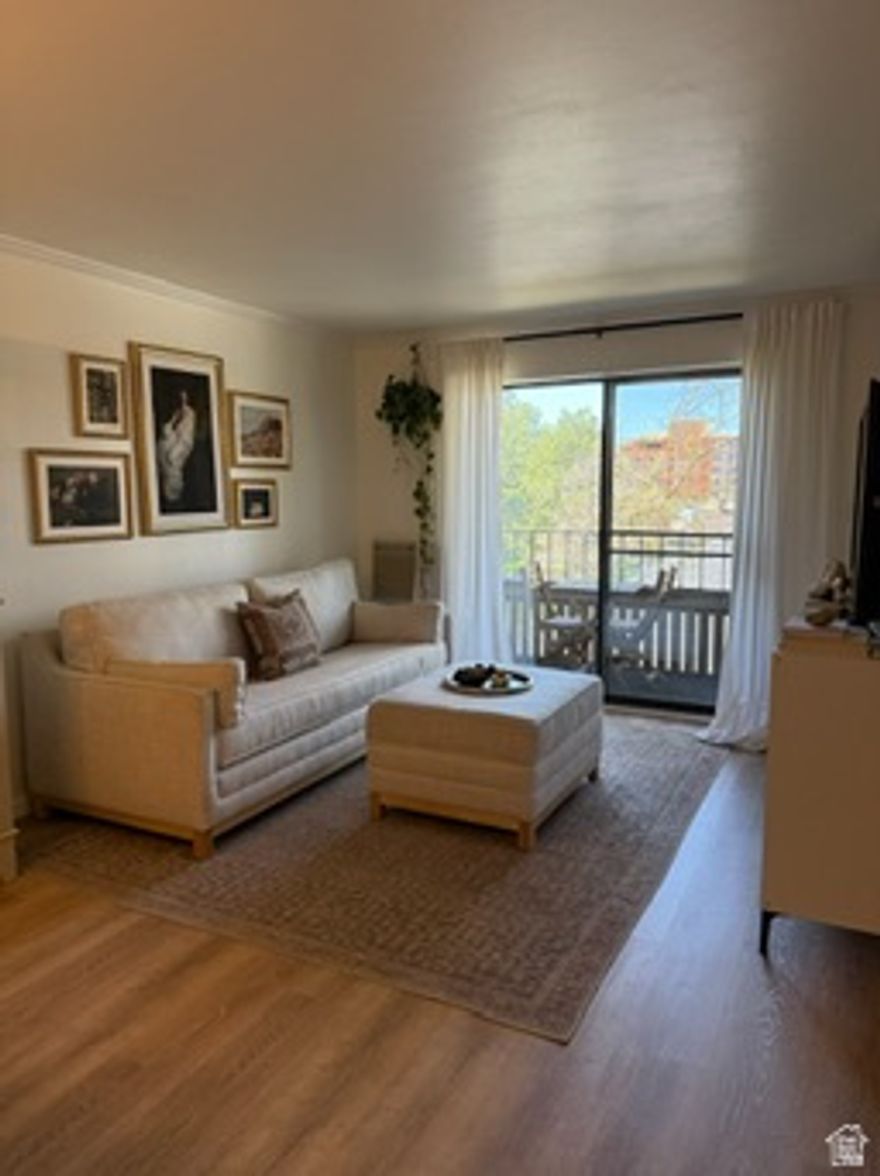 Say hello to your new home. This beautifully updated single level condo offers comfort, convenience, and easy living. You will love the gated private parking, secure entrance, elevator access, and how easily accessible the building is. Once you are off the elevator, your front door is just right there, super close quiet and convenient. Inside, the space feels bright and welcoming with a great mix of natural light and thoughtful updates throughout. The kitchen has newer appliances and had freshly painted cabinets, updated hardware, and opens right into the dining and living areas for that open, great room feel. New LVP flooring, fresh paint, an updated bathroom, and two newer mini splits for efficient heating and cooling. This one bedroom, one bath condo also has a shaded private deck overlooking the pool, perfect for relaxing or timing your next swim.The community has so much to offer with pickleball and tennis courts, garden spaces, a dog run, barbecue area, clubhouse, and a gym.You are right in the heart of downtown Salt Lake City with easy access to shopping, restaurants, entertainment, and public transportation. You are also close to parks and outdoor recreation, giving you the best of both city living and getting outside. Such a great mix of convenience, updates, and community all in one place.