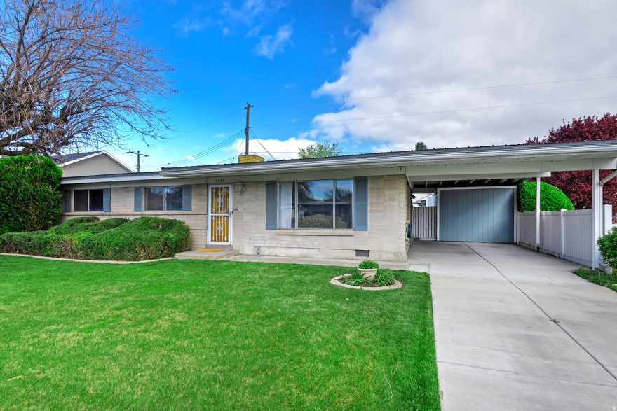 Charming single-level living in the heart of Salt Lake City! This inviting home offers true main floor living with a functional layout featuring 3 bedrooms and 1.5 baths. Perfectly situated just minutes from shopping, dining, and Salt Lake International Airport, with an easy 20-minute drive to world-class skiing-including renowned resorts like Snowbird Ski Resort and Alta Ski Area. Step outside to a spacious, private lot surrounded by mature trees, creating a peaceful backyard retreat. The fully fenced yard includes automatic sprinklers and a massive RV pad-ideal for all your toys and extra parking needs. A rare combination of location, convenience, and outdoor space-don't miss your chance to make this home yours!