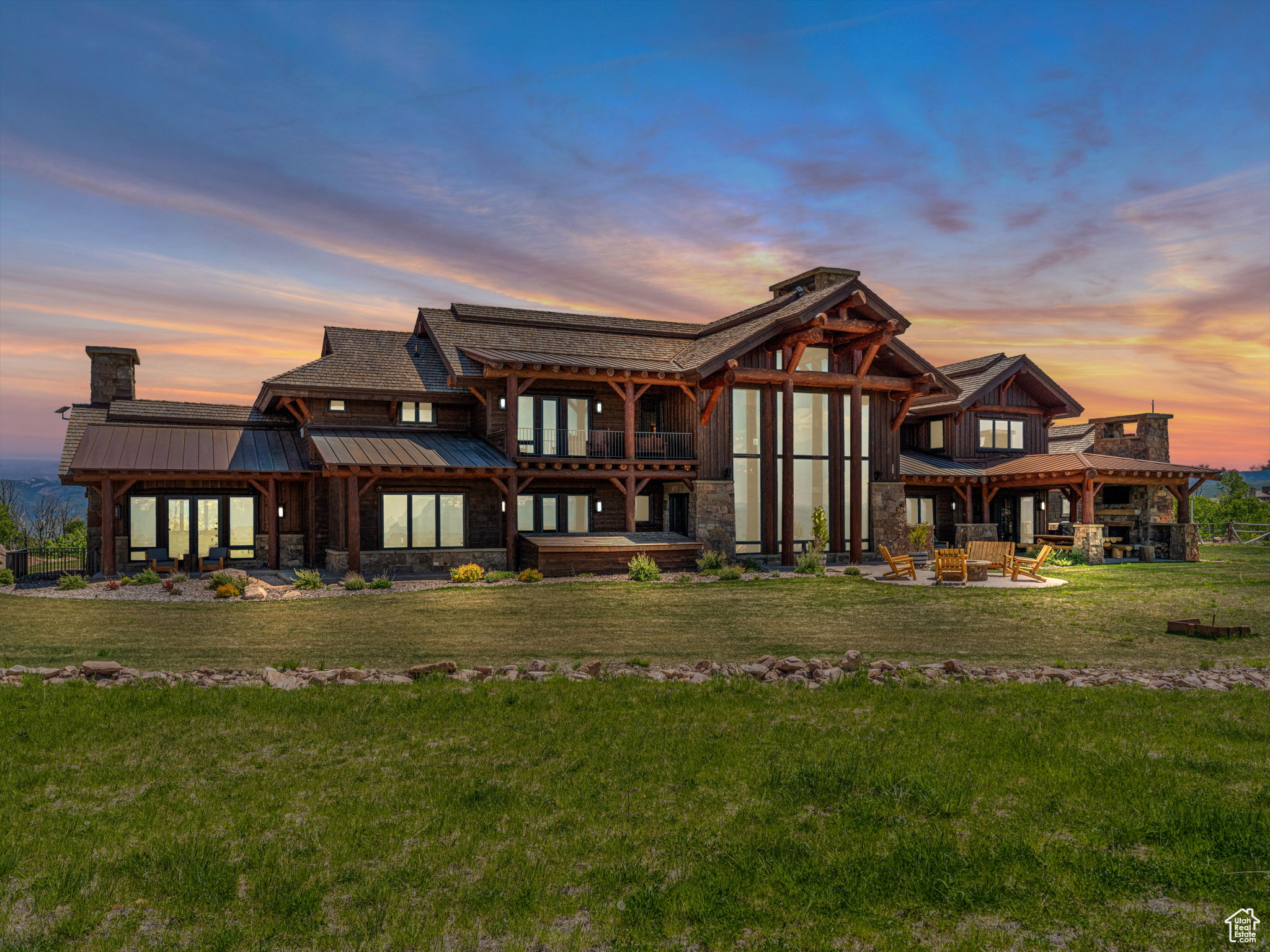 Welcome to Roll Tide Ranch a newly-built legacy mountaintop equestrian estate set on 168 acres. Nestled within the gated Wolf Creek Ranch community, this estate offers unparalleled privacy while being just 15 minutes from downtown Heber City, 20 minutes from Heber Valley Airport, 30 minutes from Deer Valley Resort, and 40 minutes from Park City's historic Main Street. As you enter the private gate, the driveway winds through a serene mountain landscape, showcasing mature Aspen trees and hinting at the grandeur. Completed in 2020, this estate features 8 bedrooms and 11 bathrooms, providing ample space for large corporate groups, family, and friends. Guests are greeted at the heated port-a-cochere and enter through the front door, awed by a great room with 36-foot ceilings and oversized windows perfectly framing views of Mt. Timpanogos. The main level features a saloon-style bar, evoking charm and hospitality, just steps away from the home theater. Next to the office on the main level, the primary suite offers the ultimate retreat, featuring a wood-burning fireplace and vaulted beamed ceiling for a true mountain feel. The gourmet kitchen, centered around a large island topped with leathered granite, is equipped with two Wolf ranges, two Subzero refrigerators, Miele coffee station, and a butler's pantry-perfect for hosting in the dining room or on the outdoor patio with heaters and a wood-burning fireplace. The large, flat green lawn area offers complete privacy and a perfect outdoor recreational playground, for hosting weddings, and entertain family and friends. For relaxation and wellness, enjoy the yoga space with a steam room and dry sauna, or retreat to the exterior yoga deck. Additional amenities include two family rooms, climate-controlled wine room, a ventilated cigar lounge, one of two safe rooms, game room, fully equipped exercise room, laundry areas on each level, Savant home automation system, radiant heat, and air conditioning. Wolf Creek Ranch spans 13,200 acres, with 94% protected open space and year-round access via fully paved roads. Bordering 2.2 million acres of Uinta National Forest with private access, it is a haven for outdoor enthusiasts in Northern Utah. Observe elk and other wildlife from your backyard, or explore over 60 miles of community trails for hiking, biking, horseback riding, ATVing in the summer, or cross-country skiing and snowmobiling in the winter. Community amenities include the ranch center for social gatherings, a guest lodge and yurts for owners to rent, one mile of private access to the upper Provo River for fly-fishing, several ponds stocked with trout, and more, all less than an hour from the new Salt Lake City International Airport.
