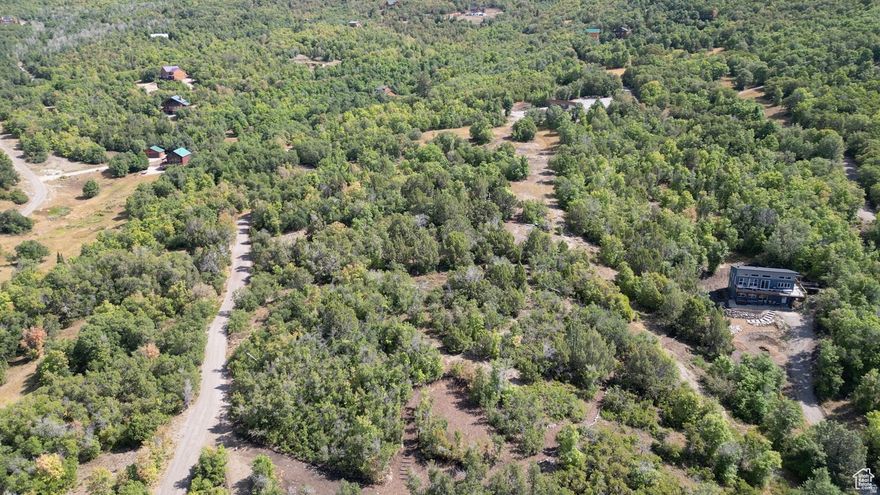 Lot 59 in The Hollows at Legacy Mountain offers a prime opportunity for a cabin or mountain home with both convenience and breathtaking scenery. This lot captures sweeping valley views-including Mt. Nebo to the west-while backing to mountain terrain and open space for added privacy. What sets Lot 59 apart is that it already has a water connection in place: the impact fee has been paid, and the infrastructure is installed and ready to use. This saves a new owner significant time and expense, streamlining the process of designing and building. The property also enjoys frequent visits from local wildlife, dark-sky stargazing, and year-round natural beauty. With the infrastructure advantage, Lot 59 is an ideal choice for those looking to start their build sooner while still enjoying the peace, space, and community of Legacy Mountain. Want to own a larger piece of the mountain? The adjacent lot 62 is also available. See MLS#2108621 Buyer to verify all info.