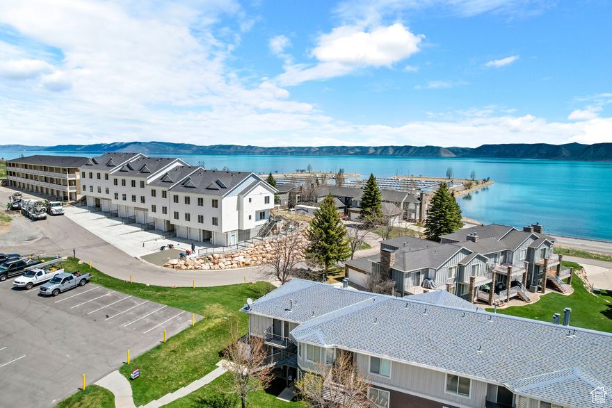 This top-level 1-bedroom, 1-bathroom condominium in the desirable Harbor Village community offers 620 sq ft of comfort and convenience, making it an ideal vacation retreat or short-term rental investment. Fully furnished and move-in ready, this unit features an inviting living space, a well-appointed kitchen, and a large bedroom. Located just minutes from Bear Lake Marina, you'll have easy access to water activities like boating and fishing, along with community amenities such as a pool, tennis courts, and walking trails. With direct access to ATV and snowmobile trails, this condo combines relaxation and adventure in one perfect package.