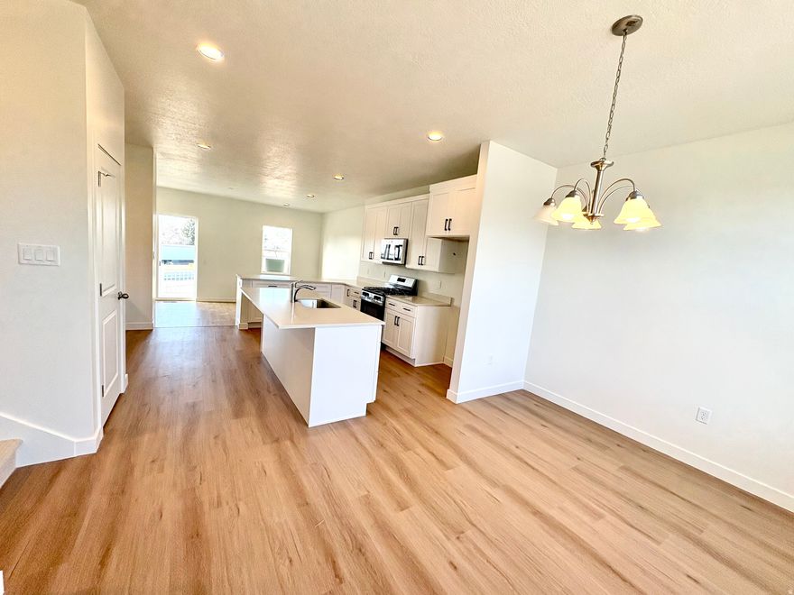 Gorgeous designer finishes and upgrades throughout this open, modern floor plan. Brand-new construction-fully completed and move-in ready! Popular Highbridge floor plan with additional units available, but they're selling fast.  This home features 3 bedrooms, 2.5 bathrooms, a spacious primary suite with a private en-suite, and a versatile flex room ideal for an office, home gym, or even a 4th bedroom.  Located in a prime Layton location near Hill Air Force Base, I-15, shopping, dining, Lagoon, and scenic trails. Enjoy having a community park just steps away! Perfectly positioned right off Main Street, giving you walkable access to restaurants and less than a mile from Layton Hills Mall.  Incredible incentives: Seller is offering a 2/1 Buydown with interest rates starting in the 34% range (call for details). This home also qualifies for the $20K Utah Housing Grant!