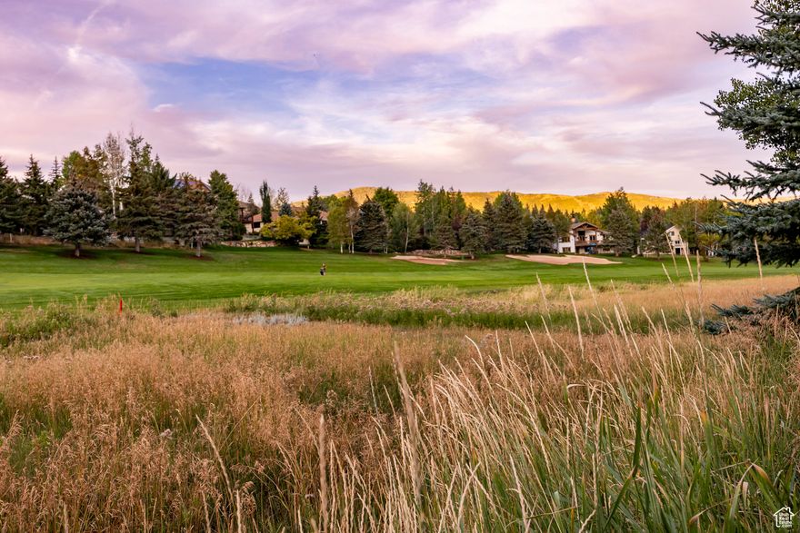 Enjoy mountain living at its finest in this spacious residence, perfectly situated on the 3rd Fairway of Jeremy Ranch Golf and Country Club. Offering main-level living and abundant space for family, entertaining, and guests, this home truly meets every lifestyle need. The entry foyer opens to an expansive great room with vaulted ceilings, oak floors, and walls of windows framing serene golf course views. A natural stone fireplace anchors the room, flanked by custom cabinetry and a wet bar, ideal for year-round entertaining. French doors extend the living space to an oversized deck, where teak furnishings invite alfresco dining or quiet mornings. A bespoke office/library provides custom cabinetry, work space, and ample shelving, while the informal dining area comfortably seats eight and flows seamlessly to both the deck and the remodeled kitchen. At the heart of the home, the professionally designed kitchen combines craftsmanship and functionality. Handcrafted walnut cabinetry, quartz countertops, and Jenn-Air stainless appliances set the stage for gourmet cooking, while the central island encourages connection over coffee or conversation. A discreet "command center" enhances organization, making this a kitchen as practical as it is beautiful. The primary suite is a private retreat with vaulted ceilings, oak floors, and French doors leading to a balcony. Its spa-inspired bath offers a jetted tub, oversized shower, radiant-heated floors, and a custom double vanity. A second ensuite bedroom on the main level is ideal for guests or family. The walk-out lower level offers exceptional versatility, perfect for extended family, a mother-in-law apartment, or lively entertaining. A spacious family room with fireplace, kitchenette, billiards area, and sunroom with patio access creates multiple gathering zones. Two additional bedrooms, bathroom and abundant storage provide comfort and convenience. The three-car garage provides storage and convenience, with one bay thoughtfully designed as a flexible space - perfect for a workshop or ski-prep area. Outdoors mature trees lend privacy, while a fenced vegetable garden enjoys the mountain sun. From abundant wildlife watching to serene stargazing on the deck, this home is designed for a life well-lived, both inside and out. Just minutes from Park City Mountain and Deer Valley resorts - and with Salt Lake City and its international airport a short drive away - this property is a rare offering: a welcoming family retreat with effortless access to world-class skiing, mountain trails, and urban conveniences. Experience the best of mountain living - elevated.