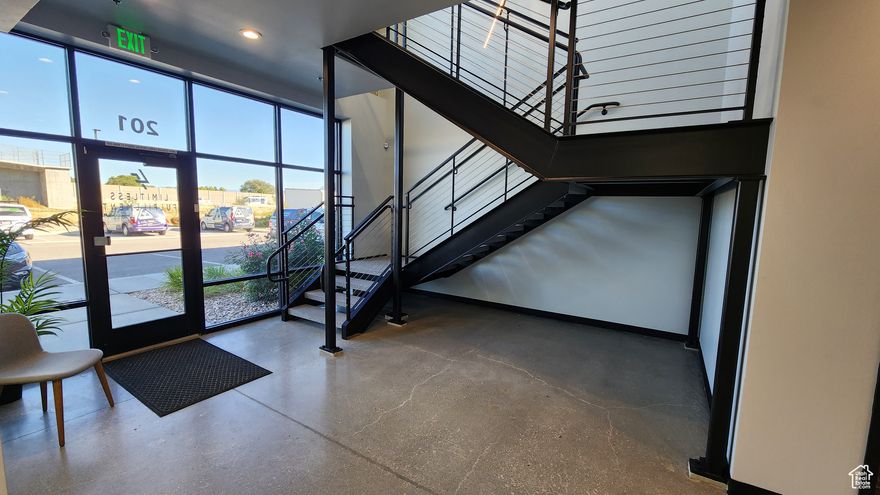 OFFICE SQ/FT: 3,100 (approximately 1,550 main floor & 1,550 upstairs) WAREHOUSE SQ/FT: 4,200 TOTAL: 7,300 SF  Incredible office & warehouse unit with 27' high warehouse ceilings clear height, truck access, 16' ground level door, and large windows with lots of natural light.  This building offers a two story office with modern glass walls, modern lights, high end bathroom finishes, and powder coated steel. Would be an amazing building for either an investment or an owner occupied user.   Centrally located in Bluffdale right off of Bangerter Highway, in between Salt Lake County & Utah County. Perfect location for a small business. 480V power on the back panel. Warehouse lighting is run on 277v from the rear panel.  Transformer up near office space to convert to 110v for main office panels. Extremely heavy duty 20' tall C channel structural steel racking. Could be included with the sale if purchased separately.  Full Facility Security System - Key Card door entry system. - 6 Cameras - Can have 24/7 Alarm Monitoring through Arco Alarm.