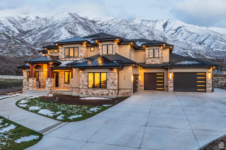 Positioned at the end of a quiet cul-de-sac on what is arguably one of the premier lots in the development, this stunning 8,287 sq. ft. residence is special. Completed in the fall of 2024, the home offers an ideal balance of refined luxury, thoughtful design, and exceptional livability. With four spacious bedrooms, a sophisticated home office, a luxurious primary suite, and an entertainer's dream floor plan, this home is both elegant and inviting. The heart of the home is the gourmet kitchen and dramatic two-story family room-designed for gathering, hosting, and everyday comfort. The kitchen features a top-of-the-line Thermador gas range with double ovens, full-size SubZero refrigerator and freezer, dual dishwashers, and an expansive butler's pantry outfitted with two additional ovens, an ice maker, and abundant storage and prep space. Upstairs you'll find two generously sized bedrooms, a cozy den, and a spacious bonus room that opens to a covered deck with views. The lower level is designed for fun and relaxation, featuring a large open game area, a state-of-the-art theater room, golf simulator space, sauna, full wet bar, exercise room, and a private guest suite with its own bathroom. Set on 1.16 acres, the property offers an expansive backyard with unobstructed mountain views and outstanding privacy. Much of the pool is already in place, and there are a lot of options for customizing the rest of the backyard. One of the standout features of the home is its impressive garage and storage capacity. With a main-level four-car garage and an additional two-car garage on the lower level-not to mention extensive storage-you'll never run out of space. Why spend years designing and building, when you can move into this extraordinary home and start enjoying it today! Schedule your private showing and experience one of the finest homes on the market.