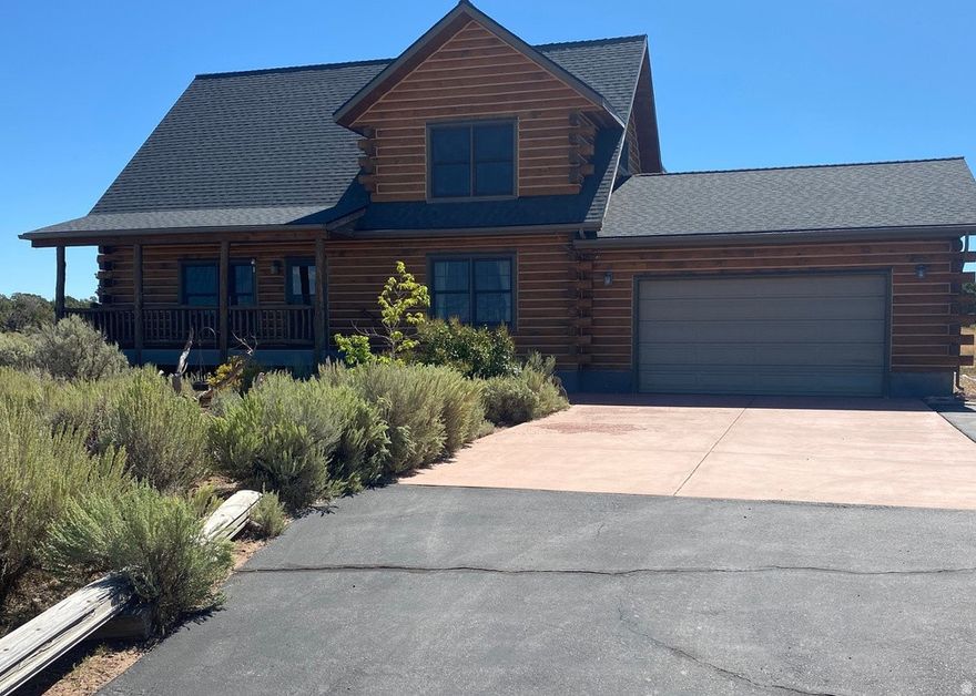 Custom Log Home on 45.08 acres of privacy viewing the Uintah Mountains! Cathedral ceilings! This house is D Log Construction. Open living room, kitchen, and dining! 1 bedroom and bath downstairs, Master bedroom and bath upstairs includes a huge walk-in closet! Laundry room by the entrance to the 2 car attached garage. Propane forced air, Power, and septic system. Covered front porch. Peaceful sitting area in the back yard with beautiful landscaping. About 10 minutes north of Duchesne. Assumable 5.25% interest rate for VA Qualified Buyers. 6 parcel ID numbers included in this one! Square footage figures are provided as a courtesy estimate only and were obtained from Duchesne County . Buyer is advised to obtain an independent measurement. Parcel ID List: 00-0018-0012, 00-0018-0020, 00-0017-9907, 00-0018-0004, 00-0017-9998, 00-0017-9915
