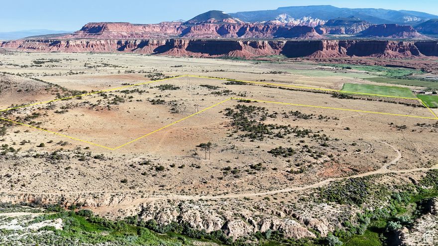 The first thing you notice when entering this property is the awe-inspiring backdrop created by the Velvet Ridge, with 'The Ant Hill' rising majestically above the massive red bluffs. Indeed, the views in nearly every direction are nothing short of spectacular, with the Boulder Mountains rising to the South and Capitol Reef National Park just minutes away to the east. It is easy to see why many choose to build their dream home or lifestyle property in a setting like this. With over 120 acres located mostly on the Teasdale Bench, this property is secluded while also offering easy access to all the conveniences of Town.  The majority of the property is located on a mainly flat high mesa with scattered Pinyon-Juniper Forest and large lava rocks typical of southern Utah. The property drops off nearly 100' at the Northernmost point, with the Fremont River visible from the property. Standing in several places along the southeastern border of the property provides you with views of Cottonwood Creek, which mule deer and a variety of wildlife frequent. The neighbor's pond offers wintering habitat for ducks and geese, which is also visible while standing on the mesa. Other signs of wildlife on the property indicate coyotes, foxes, and a variety of small game are all present. Over 30 acres of the property is covered in scattered pinyon pines and juniper trees, with the remainder of the property open meadows, cactus, and sage.   With a well permit already acquired, power running on the northern end of the property, and existing roads in place, this parcel is ready to build with multiple options for a home site(s). While being tucked away from the main flow of traffic, the property is still just over 600 yards from the paved Teasdale Bench Road and just a few minutes from Torrey. The area has a reputation for dark skies, and the stars at night are something spectacular due to the extremely low light pollution of the area.   Bordered by the Bureau of Land Management ensures that neighbors will remain few and far between. The beauty of the property and its secluded nature are something you need to experience in person. This lifestyle property is close to all things outdoors and is sure to have views that will remain awe-inspiring for generations to come.