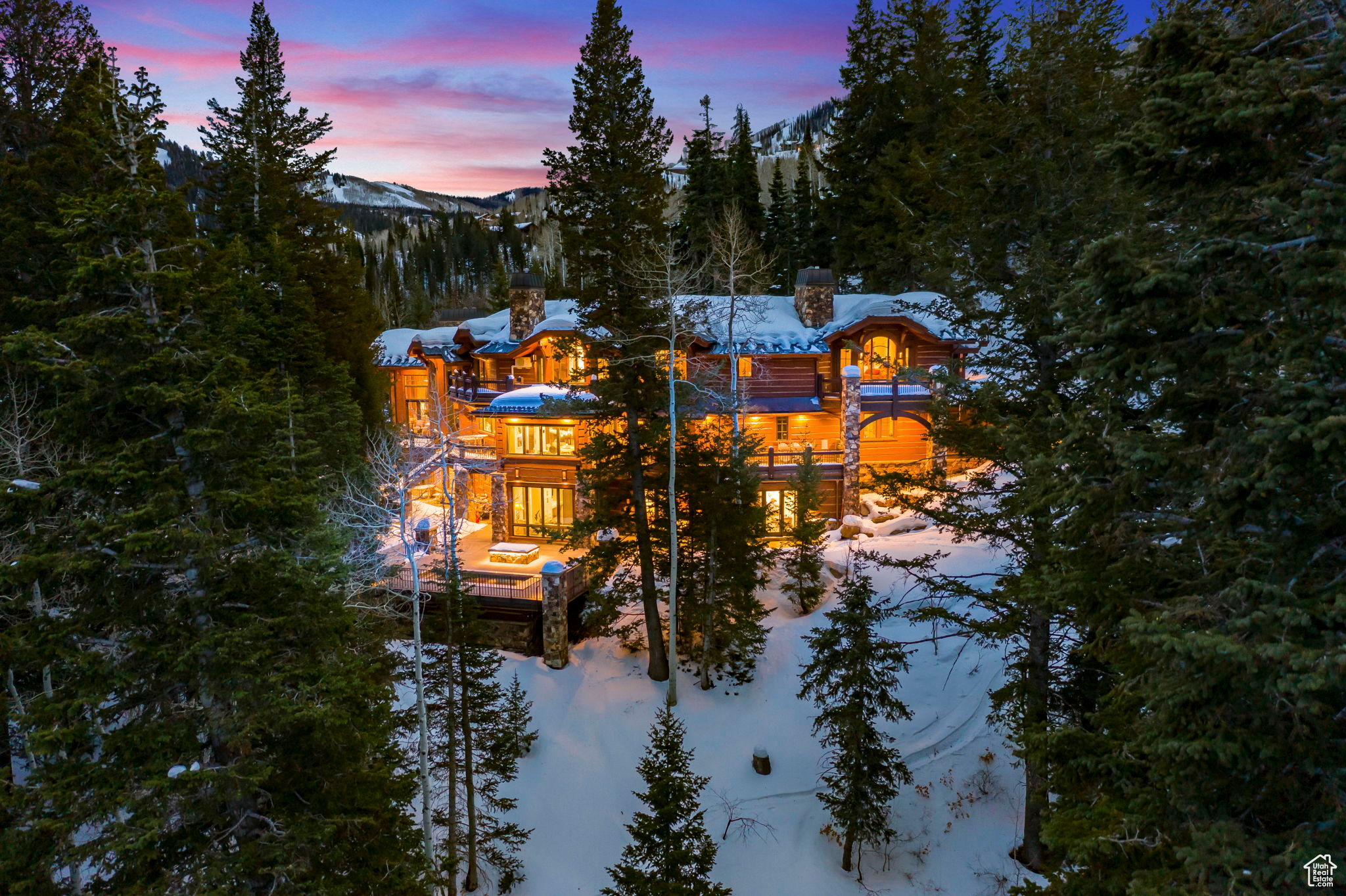 Experience an unmatched blend of luxury, convenience, and natural beauty with this turnkey, move-in ready ski-in, board-out sanctuary in the exclusive, guard-gated enclave of The Colony at White Pine Canyon. Designed by the legendary Otto-Walker Architects and built by one of Park City's top builders, this estate is a masterpiece of mountain elegance and modern sophistication. Situated on over five pristine acres at a coveted lower elevation of 7,600 feet, this rare property offers sweeping valley and resort views, serene privacy among evergreens and Aspens, and the convenience of being less than three minutes from the entry gate. From the moment you arrive, you'll be captivated by the dramatic stone entry bridge leading to a fully snow-melted driveway, accented by a stunning waterfall and tranquil summer pond. This home has been meticulously designed to be turnkey and move-in ready, seamlessly blending timeless craftsmanship with modern luxury. Recent updates include a state-of-the-art kitchen with La Cornue and Miele appliances, a fully equipped butler's pantry, an informal dining area, and a bespoke bunk room with six queen beds. A custom-crafted, 20-person stainless steel hot tub with an automatic cover offers the ultimate space for aprs-ski relaxation. Every detail has been thoughtfully curated, from furnishings selected by the award-winning Iluminus Group to the array of indulgent amenities. The home features multiple grand family rooms, two primary suites, a study, a 4K home theater, a gym with an infrared sauna and steam room, and a ski lounge with personalized lockers. A cutting-edge Savant automation and lighting control system enhances the home's functionality, allowing effortless control over lighting, entertainment, and climate. Expansive snow-melted terraces, two fire pits, and a four-bay garage provide ample space for cars, bikes, and gear, ensuring this home is as functional as it is luxurious. With direct ski-in access and board-out convenience to Park City Mountain's Tombstone, Timberline, and Over & Out lifts, adventure awaits just outside your door. Explore hiking, biking, and snowshoeing trails, or enjoy the charm of Park City's Historic Main Street, just 15 minutes away, offering fine dining, shopping, and cultural events. Salt Lake City International Airport and private FBOs are only 40 minutes away, making travel effortless. This turnkey, move-in ready estate is more than a home; it's an invitation to experience elevated living in one of The Colony's most coveted locations.